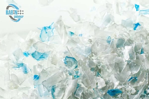 Clear and light-blue PET flakes close-up